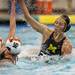 Michigan senior Kiki Golden shoots and makes contact with a Princeton player on Sunday, April 28. Daniel Brenner I AnnArbor.com
